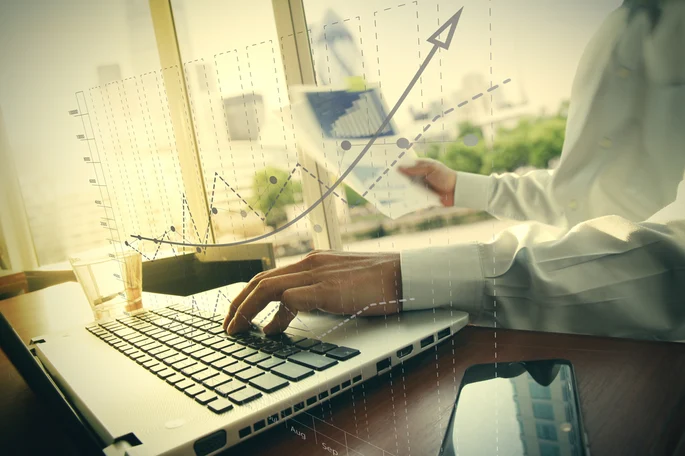 business20documents20on20office20table20with20smart20phone20and20digital20tablet20and20graph20business20diagram20and20man20working20in20the20backgroun.jpeg